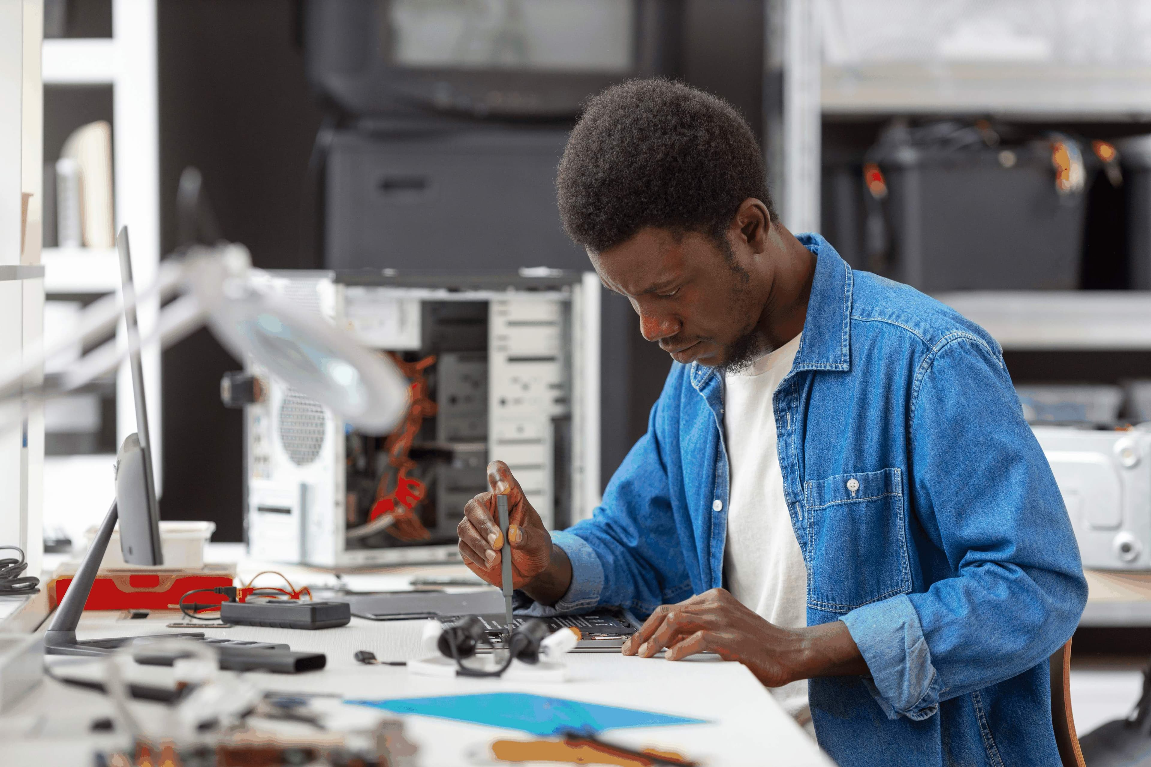 Student working with hardware components in lab